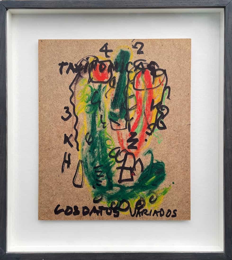 Abstract artwork on cardboard with Spanish text and bright colours