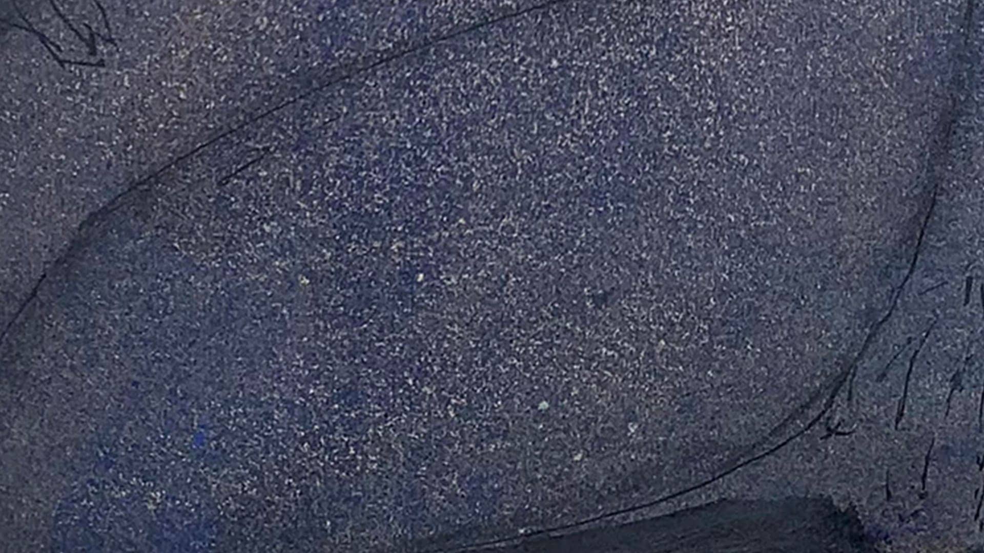 Abstract dark blue textured artwork with sweeping black lines