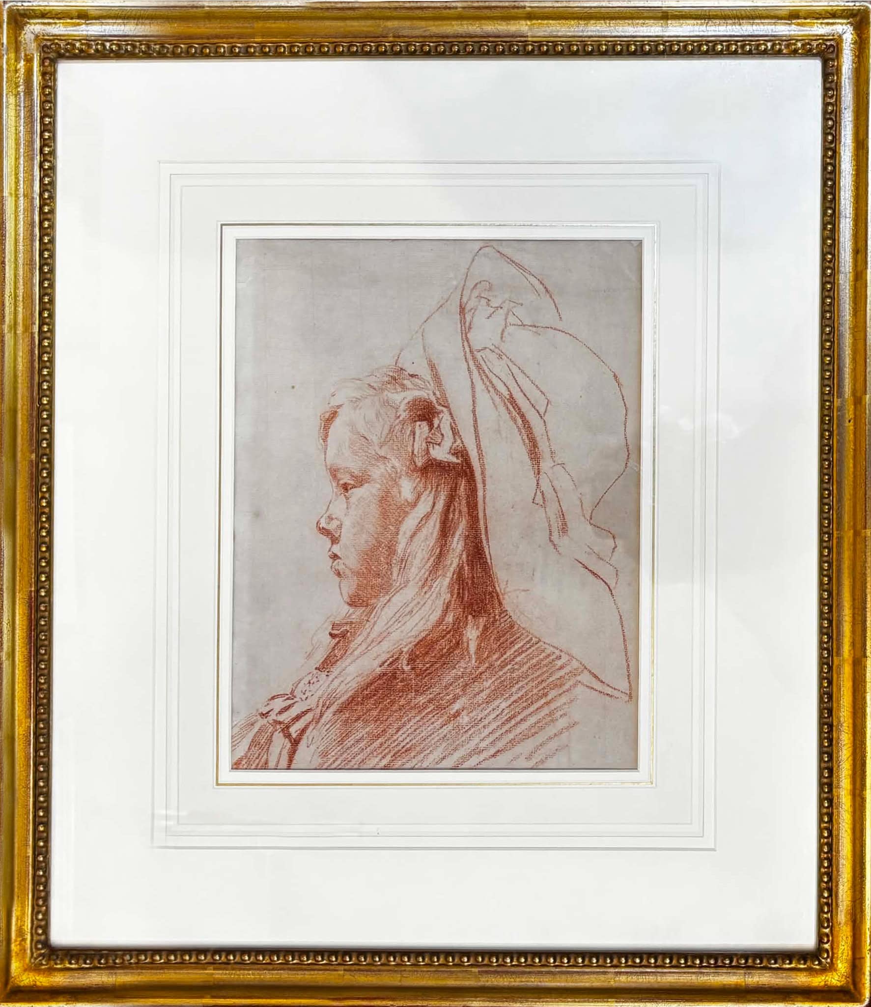 Red chalk drawing of woman in profile with headdress