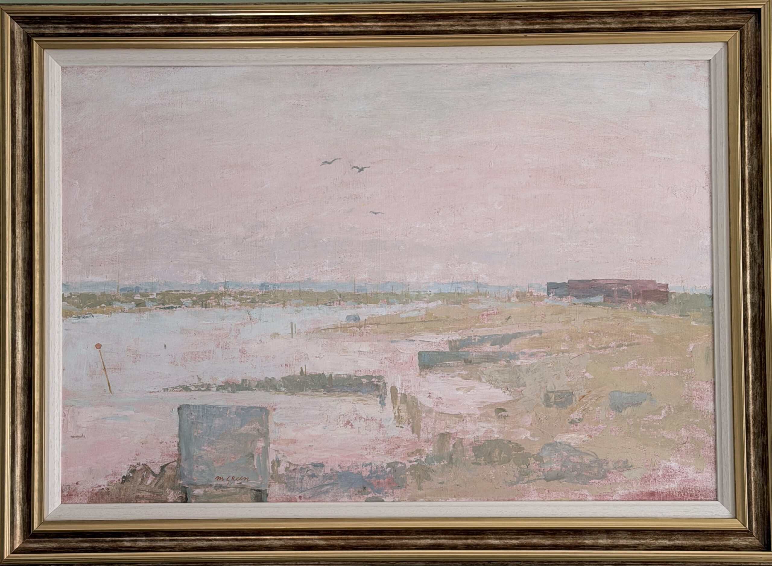 Framed oil painting of a pale pink coastal landscape